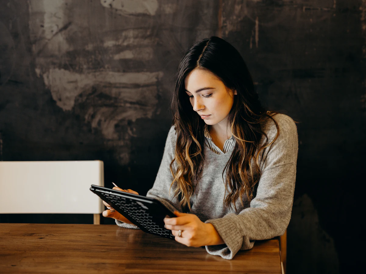 A woman reading on a tablet
